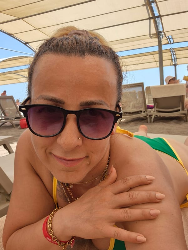 Relaxing at a beach resort, sun and gold accessories