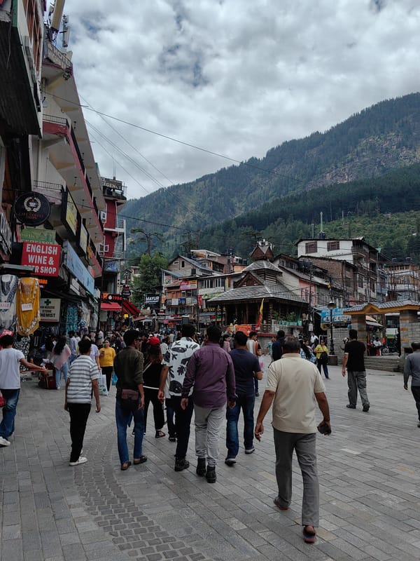 Busy morning in Manali's streets, markets, and hillside town center