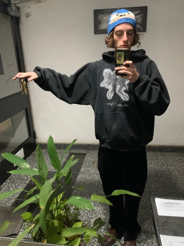 Young adult takes selfie in Buenos Aires hallway