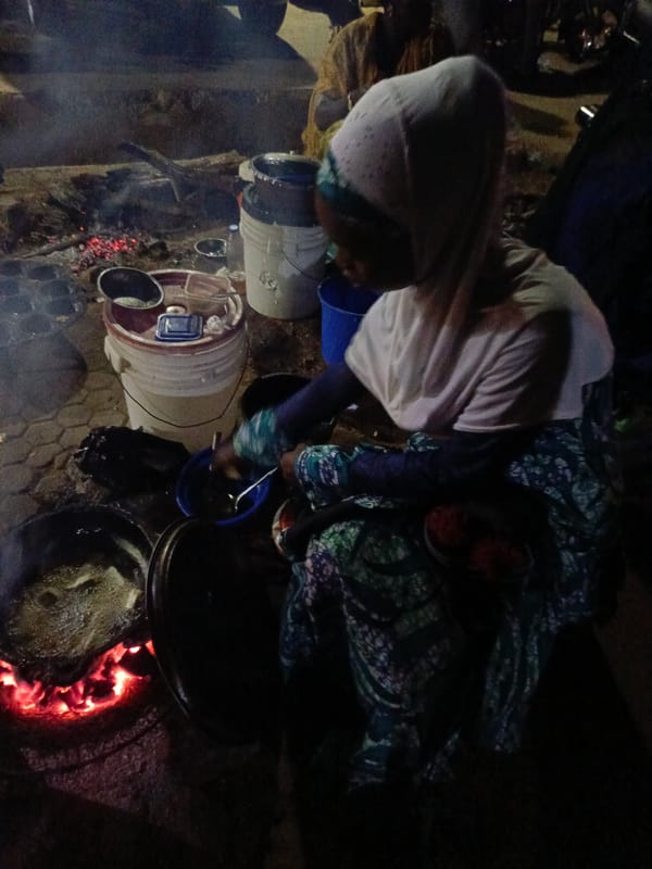 Evening community event with illuminated fountain held in Akwanga, Nigeria