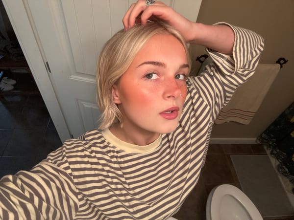 Woman takes selfies in Whistler bedroom