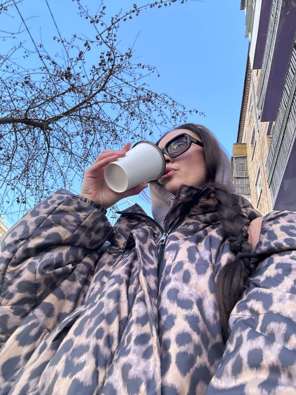 Woman enjoys morning coffee by Yenisey River in Krasnoyarsk