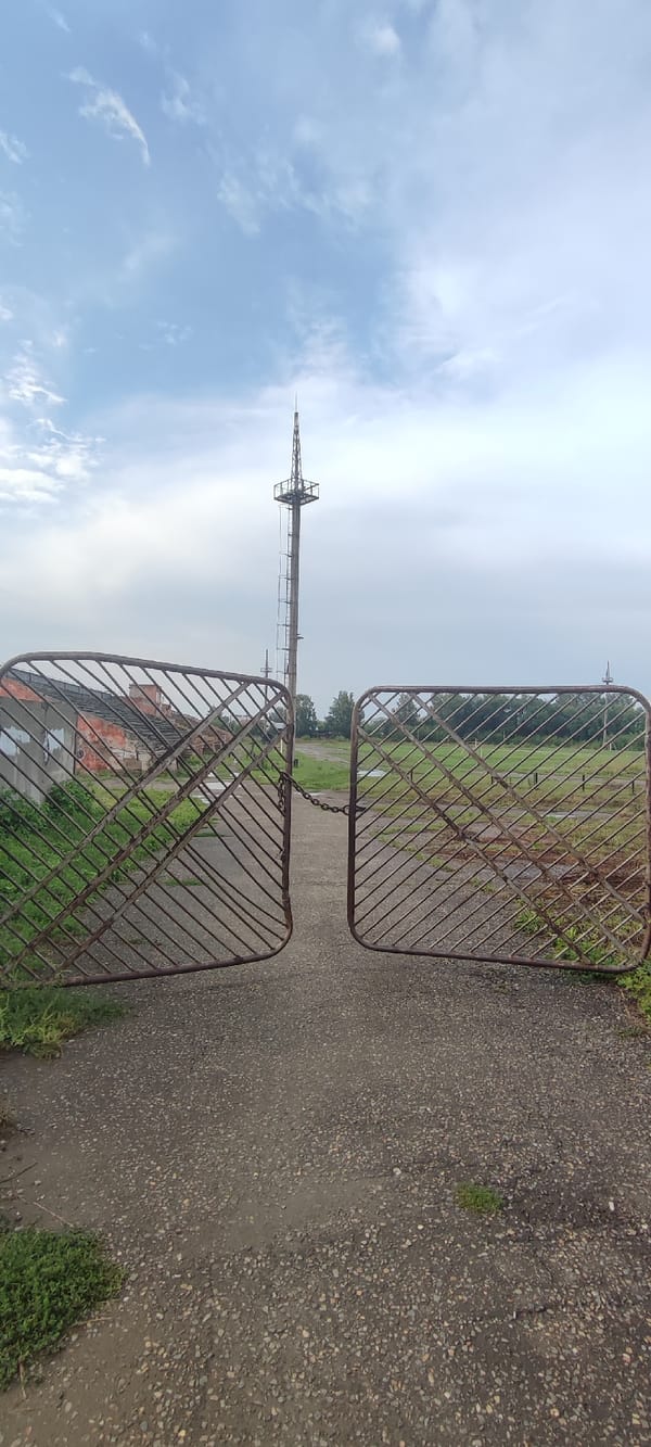 Decaying stadium and tower sit abandoned in Novoaltaysk
