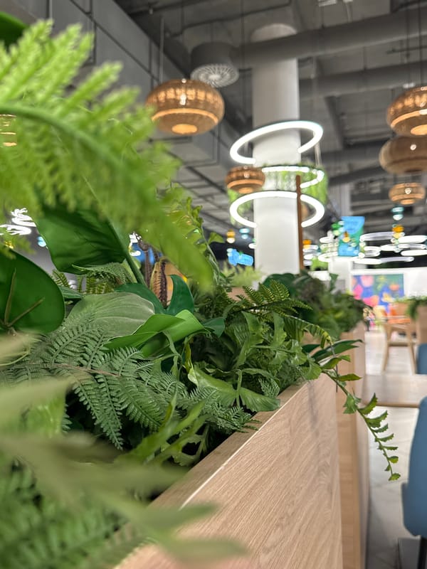 Woman with parrot, young girl observed in Khimki indoor setting