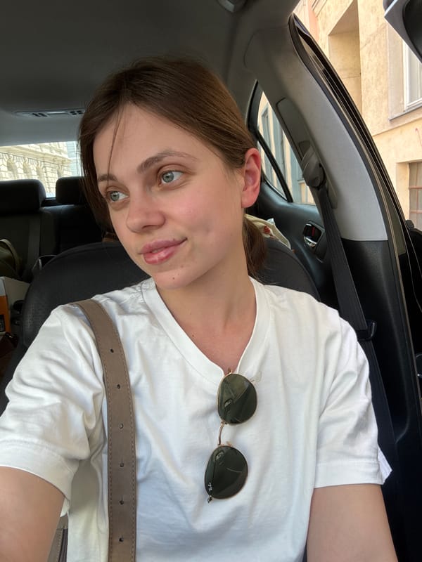 Woman sits in parked car on Vienna street