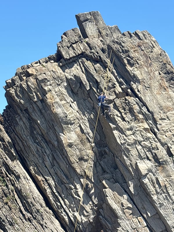 Rock climbers practice on coastal cliffs near Vladivostok beach