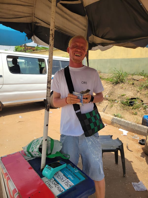 Sunny midday street life documented in Onitsha, Nigeria