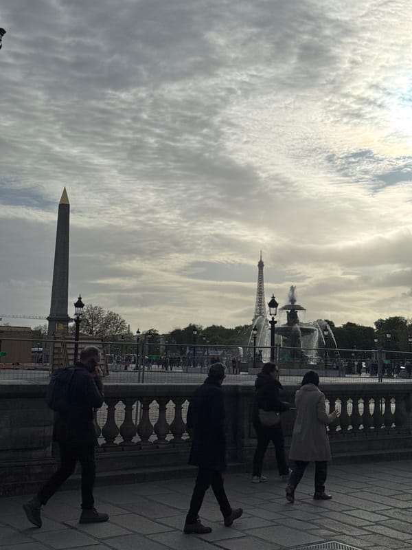 Tourist captures classic Paris vista at Place de la Concorde
