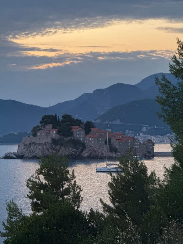Sveti Stefan at golden hour: parasailing and coastal views