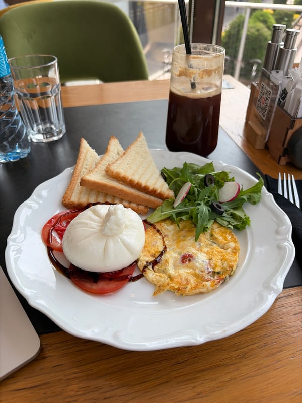 Breakfast with burrata served at Almaty café