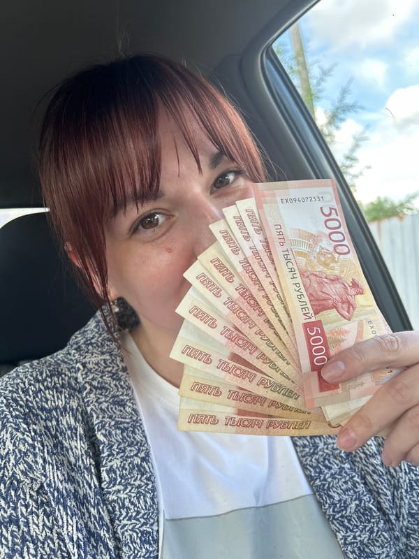 Woman displays rubles, spends time with dog in Фоки
