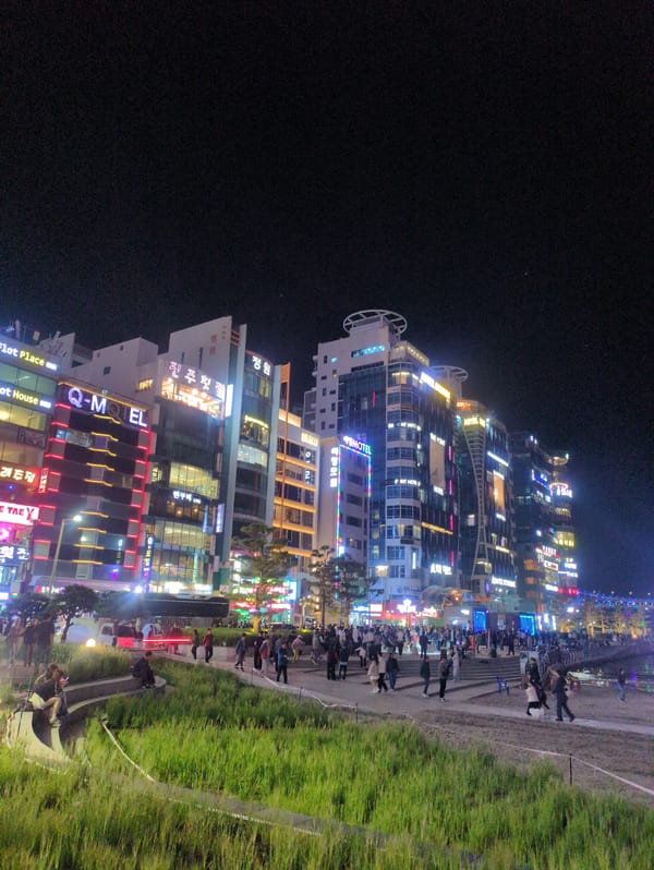 Workers set up waterfront displays near Gwangan Bridge in Busan