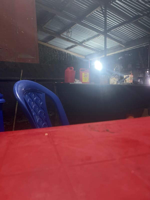 Red structures and street furniture photographed in Dar es-Salaam