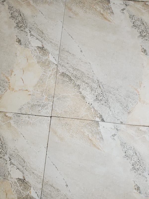 Witness documents marble-patterned tile surface installation