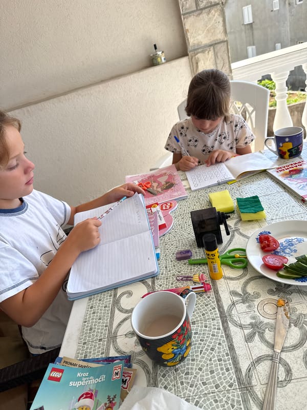 Morning moments captured in Bijela: children drawing, woman photographed