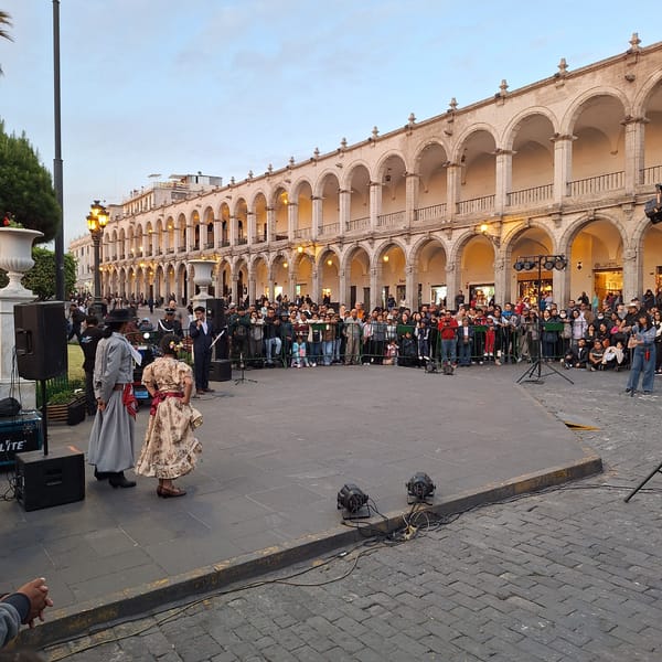 Traditional dancers perform for crowd in Arequipa plaza