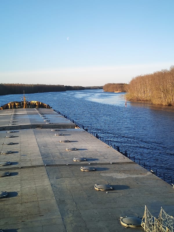 River journey documented from barge deck near Kurdiug, Russia