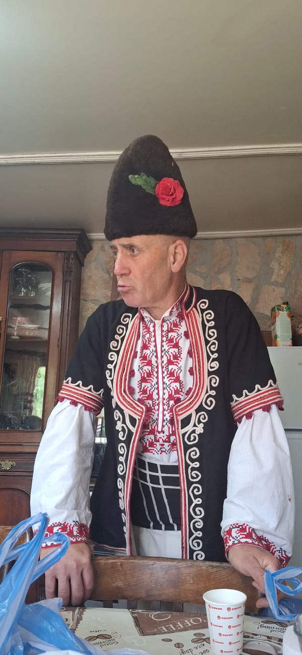 Man in traditional Bulgarian costume observed in Razhdavitsa