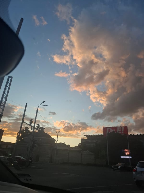 Urban sunset with dramatic clouds and street views