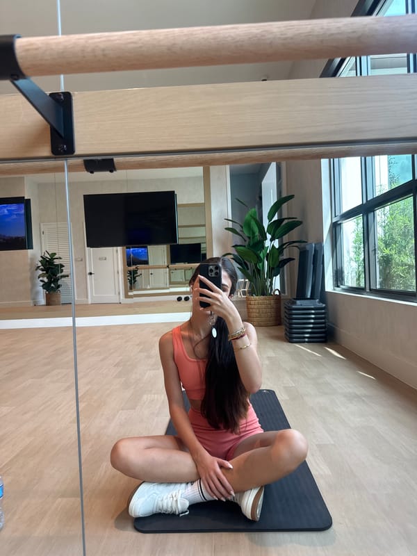 Gym session with dumbbells, yoga mat, and mirror selfies