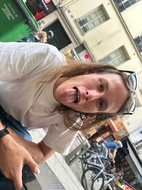 Tourists take selfies at Paris street cafe