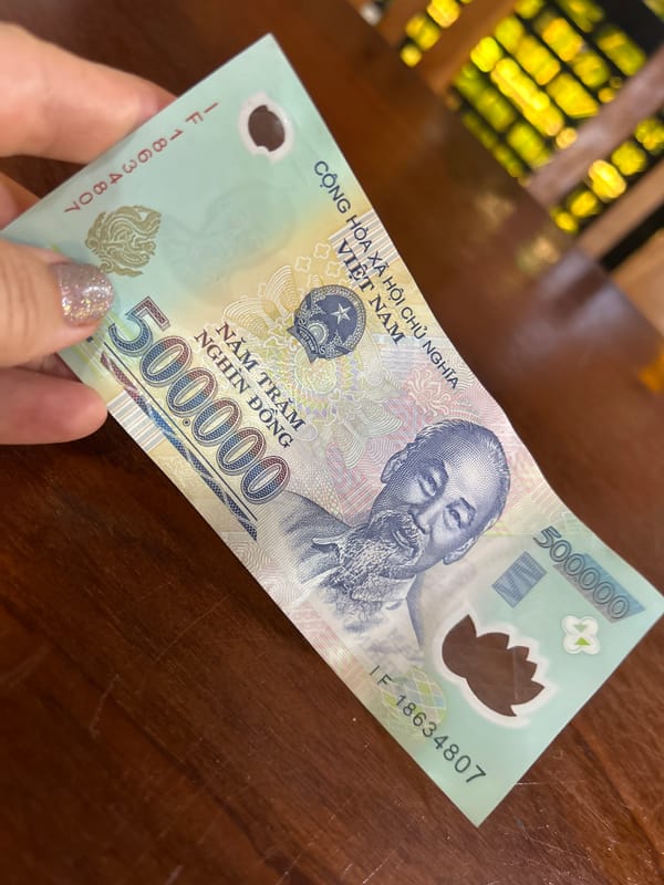 Lunch and currency documented at Nha Trang café