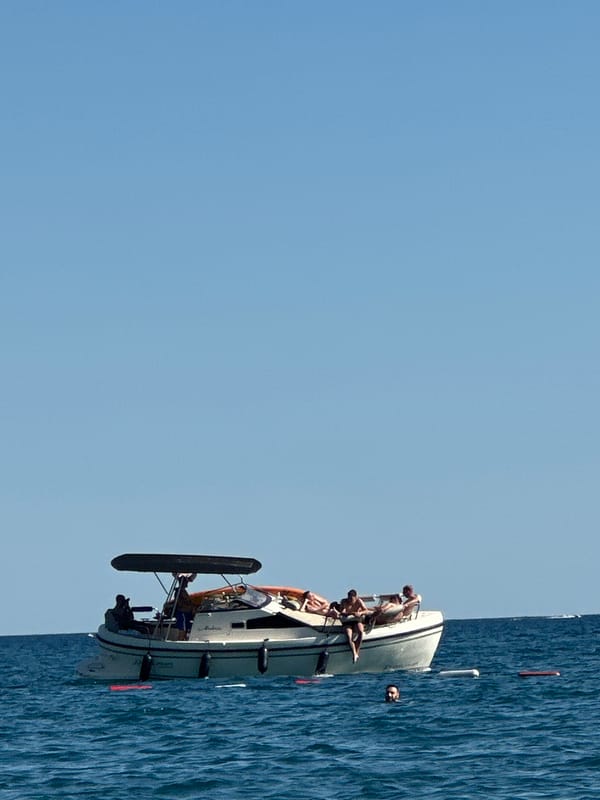 Boats and day-trippers on the Adriatic near Boreti, Montenegro
