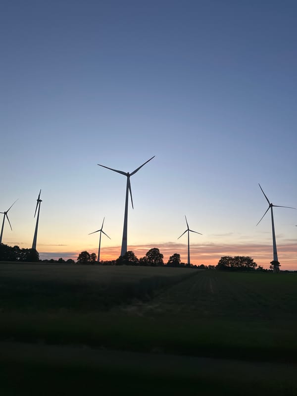 Witness documents German countryside sunset drive through wind farms