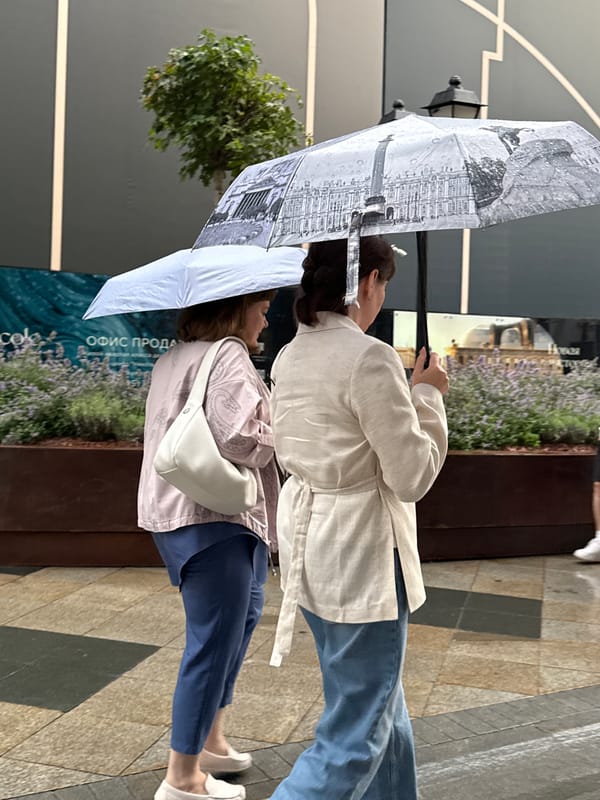 Rainy afternoon foot traffic on a Moscow pedestrian walkway