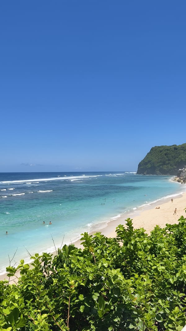 Beachgoers enjoy morning hours at Kuta Selatan coastline