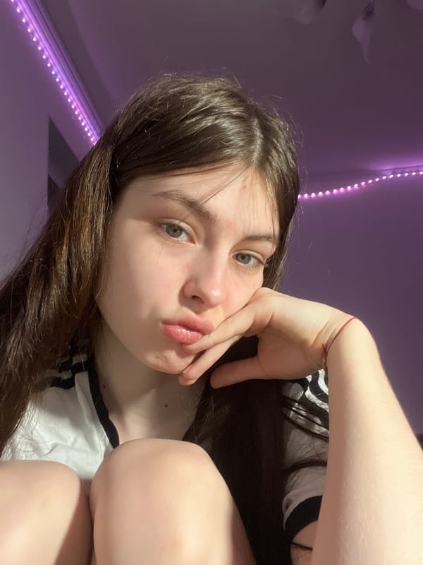 Young woman documents evening selfie session in Saint Petersburg