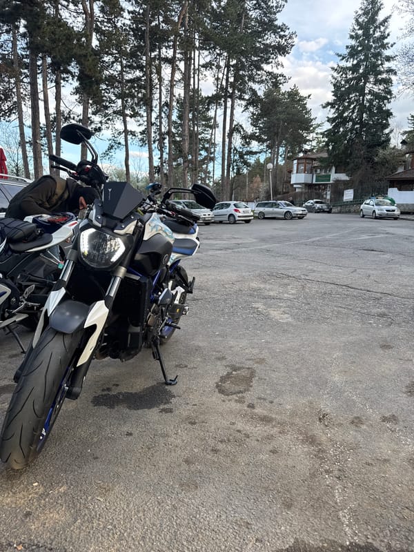 Motorcycles parked near Easter egg display in Kyustendil, Bulgaria