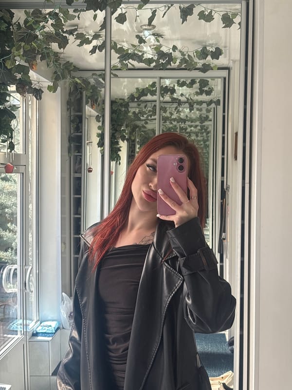 Woman conducts selfie session across multiple indoor locations in Simferopol
