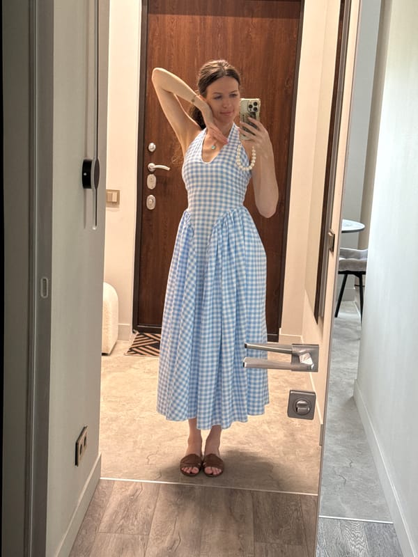 Woman takes multiple selfies in Dolgoprudny, Russia indoor setting