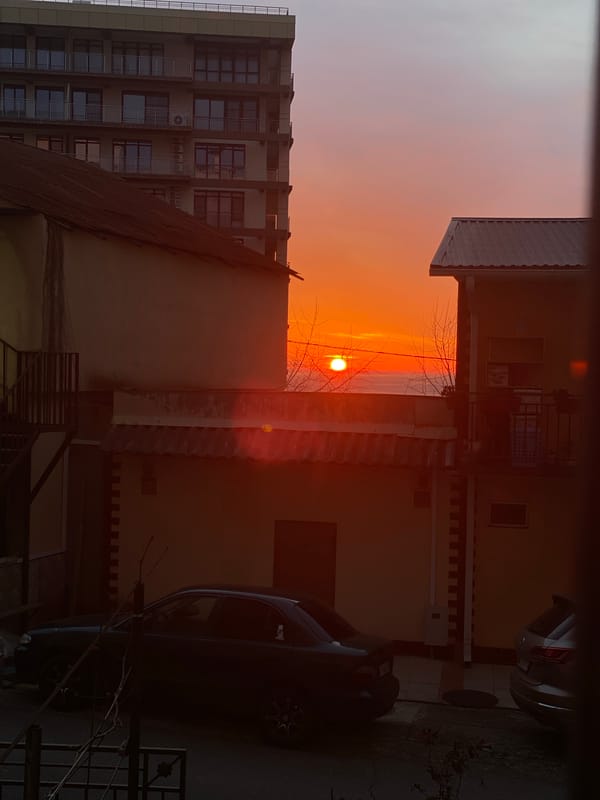 Sochi residents document sunset between buildings and family moments