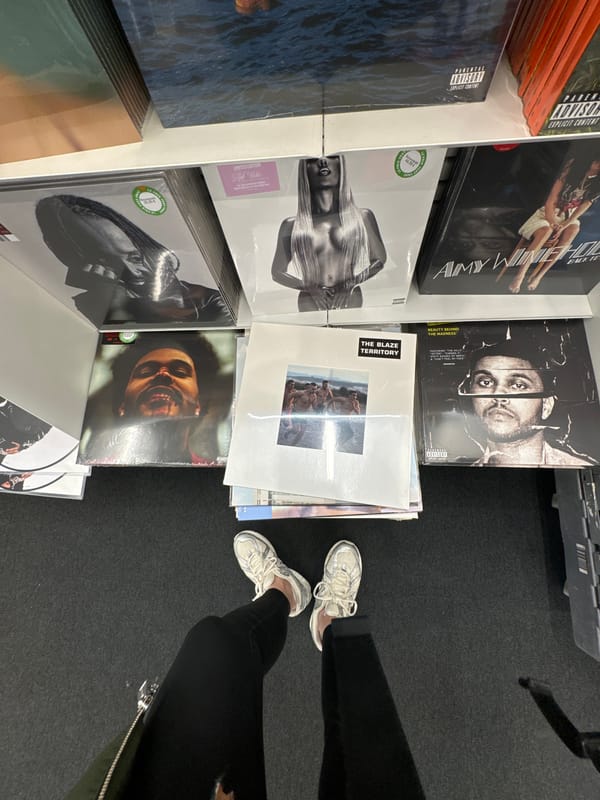 Person browses vinyl record collection in Paris