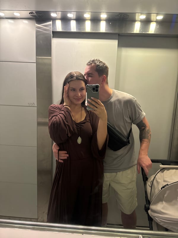 Couple with stroller photographed in elevator in Odintsovo