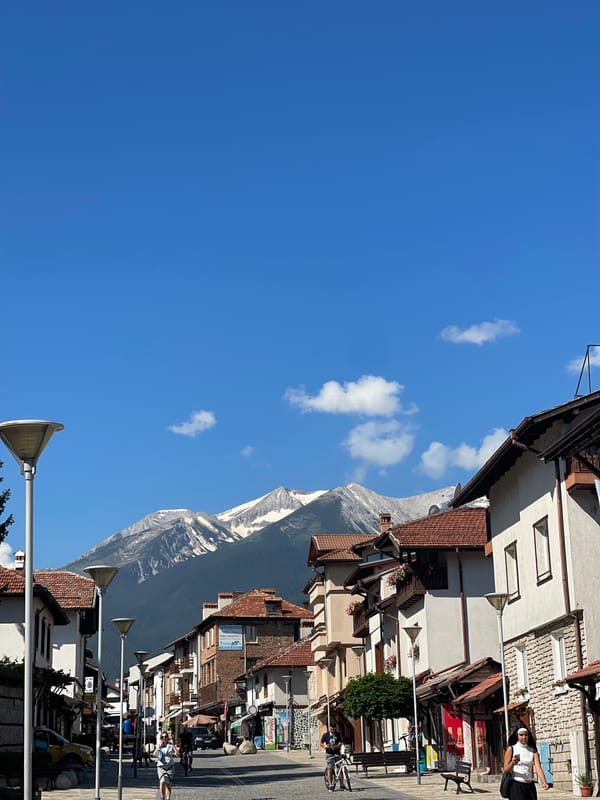 Mountain range frames the end of a quiet narrow street