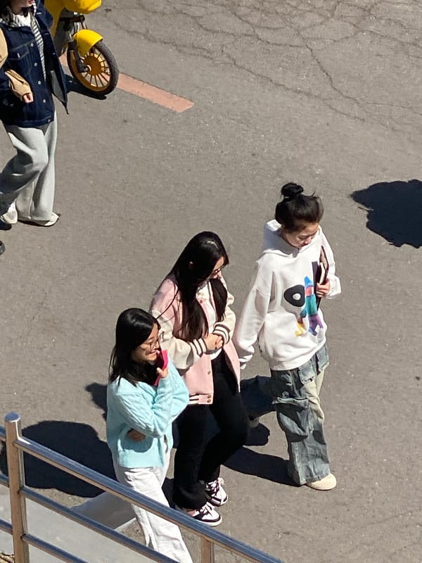Young women gather on pavement in Zhongtun, China