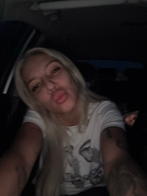 Simultaneous indoor selfie and twilight road scene in Bulgaria