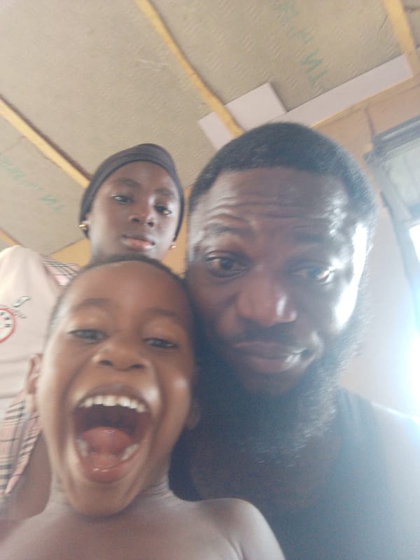 Family shares joyful moment during indoor gathering in Lokoja
