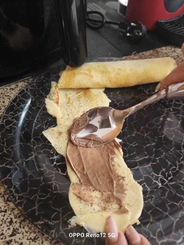 Home crêpe preparation documented in Cuéllar, Spain kitchen