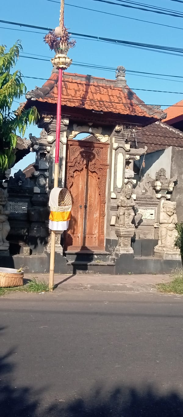 Intricately carved traditional gate open at Blahbatuh, Bali