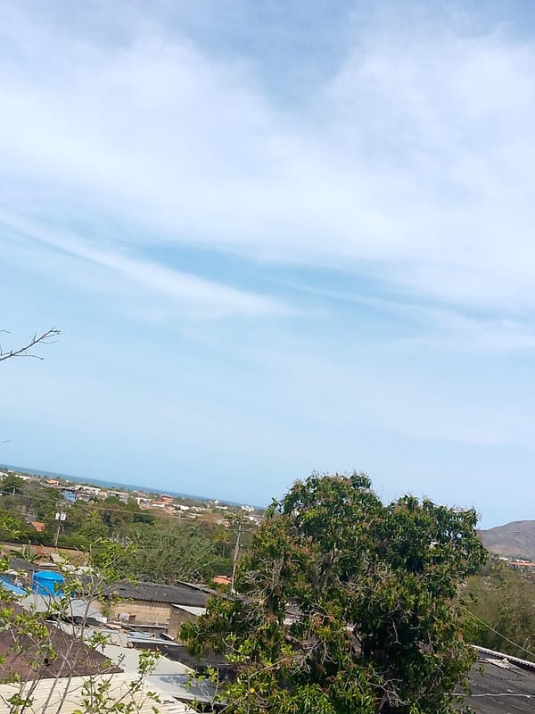 Afternoon skies documented over Juan Griego coastal city