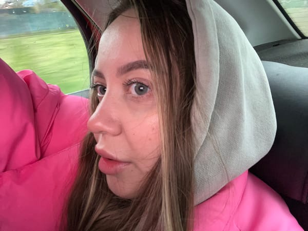 Woman in pink jacket observed driving in rainy Novopokrovskaya