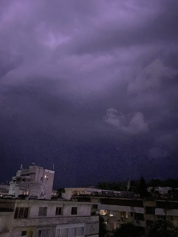 Urban night scene captured under dark, stormy skies