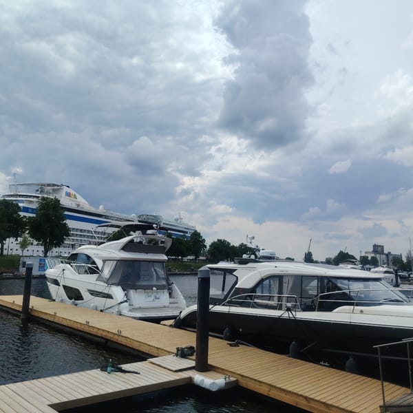 Cruise ships and luxury yachts dock in Riga harbor