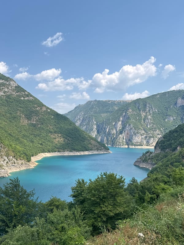 A morning on Piva Lake — boats, zip-lines, and canyon views