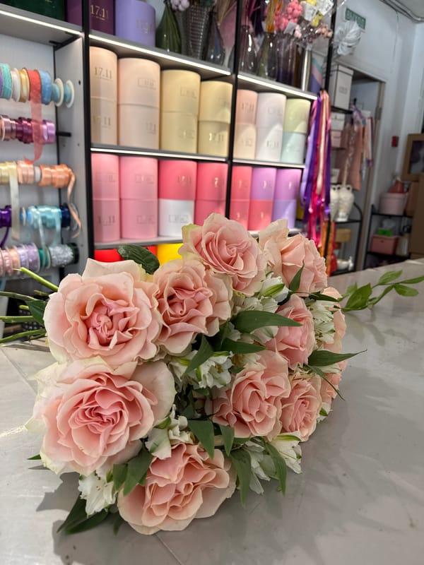 Woman takes selfie while shopping at flower shop