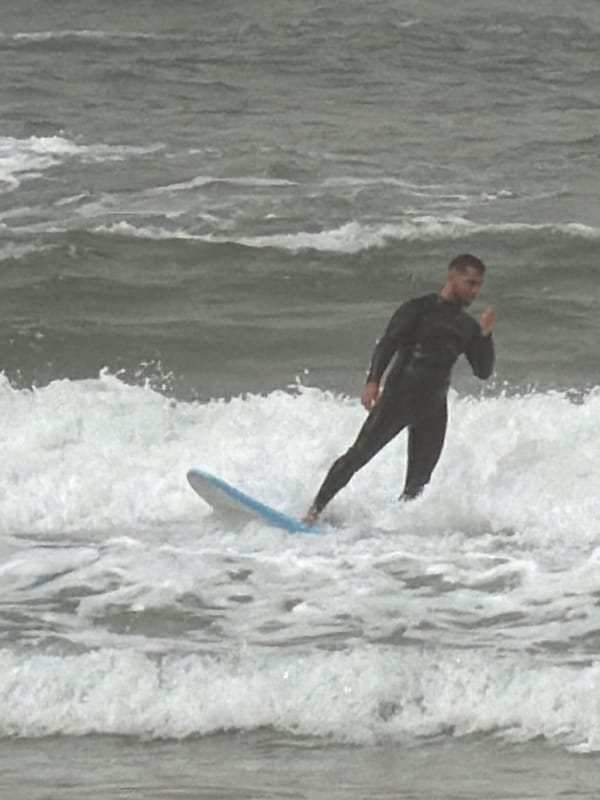 Morning scenes across Tel Aviv capture surfing and market life